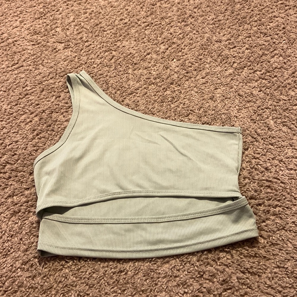 green top with cut out in the middle